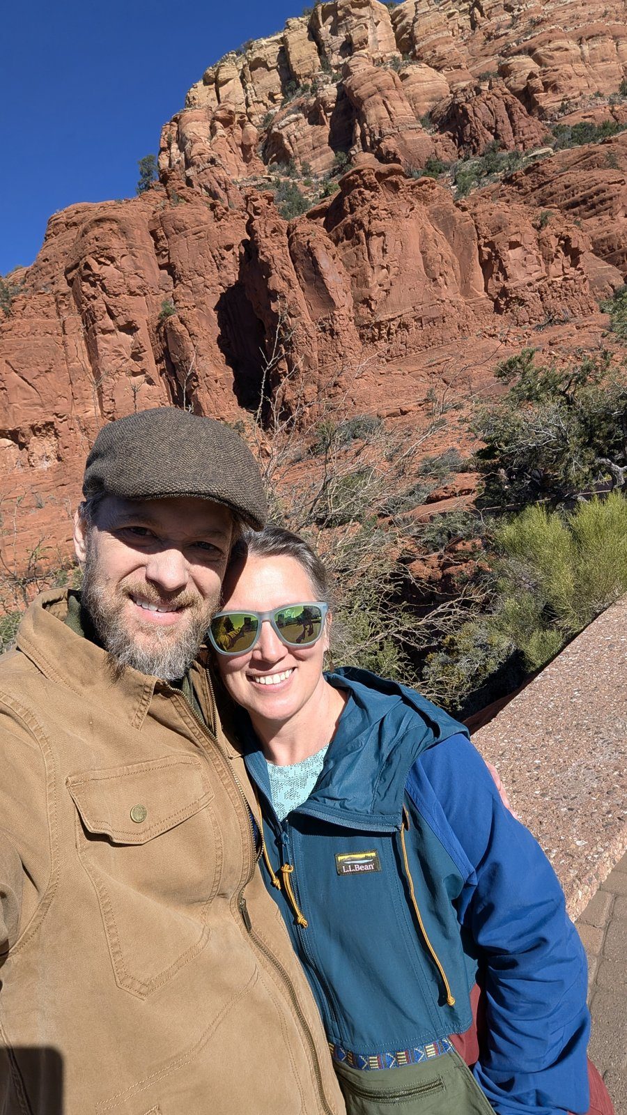 Ben Page and his wife on red rock.
